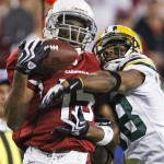 Arizona Cardinals' Steve Breaston (15) catches a pass in front of Green Bay Packers' Tramon Williams (38) during the second half of an NFL wild-card playoff football game Sunday, Jan. 10, 2010, in Glendale, Ariz. (AP Photo/Matt York)