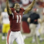 Arizona Cardinals' Larry Fitzgerald celebrates after Arizona defeated the Green Bay Packers 51-45 in overtime in an NFL wild-card playoff football game Sunday, Jan. 10, 2010, in Glendale, Ariz. (AP Photo/Paul Connors)