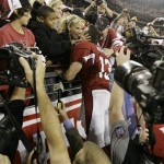 Arizona Cardinals quarterback Kurt Warner kisses his wife, Brenda, in the stands after the Cardinals defeated the Green Bay Packers 51-45 in overtime in an NFL wild-card playoff football game Sunday, Jan. 2010, in Glendale, Ariz. (AP Photo/Paul Connors)