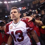 Arizona Cardinals quarterback Kurt Warner (13) walks off the field after his NFL football divisional playoff game against the New Orleans Saints in New Orleans, Saturday, Jan. 16, 2010. The Saints defeated the Cardinals 45-14 to advance to the NFC conference championship. (AP Photo/Dave Martin)