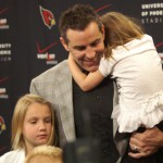 Kurt Warner's family joins him after he announced his retirement Friday, January 29, at the team's Tempe headquarters. (Adam Green/KTAR)