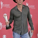 Kenny Chesney holds the award for entertainer of the year at the 42nd Annual Academy of Country Music Awards on Tuesday, May 15, 2007, in Las Vegas. (AP Photo/Eric Jamison)