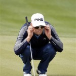 Hunter Mahan reads his putt on the ninth green during the final round of the Phoenix Open PGA golf tournament Sunday, Feb. 28, 2010, in Scottsdale, Ariz. Mahan birdied the hole. (AP Photo/Paul Connors)