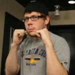 Associate Producer Garret giving his 'Punch You in the Face Tuesday' pose during the Doug & Wolf show, Tuesday, March 2, 2010. (KTAR)