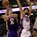 Los Angeles Lakers center Pau Gasol (16) , of Spain, is fouled by Phoenix Suns center Robin Lopez (15) during the first quarter of an NBA basketball game Friday, March 12, 2010, in Phoenix. (AP Photo/Matt York)
