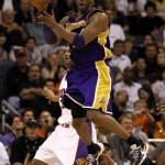 Los Angeles Lakers' Kobe Bryant passes against the Phoenix Suns during the second half of an NBA basketball game Friday, March 12, 2010, in Phoenix. The Lakers won 102-96. (AP Photo/Matt York)