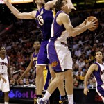 Phoenix Suns center Louis Amundson, right, is fouled by Los Angeles Lakers center Pau Gasol, of Spain, during the second half of an NBA basketball game Friday, March 12, 2010, in Phoenix. The Lakers won 102-96. (AP Photo/Matt York)