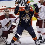 Phoenix Coyotes' goalie Ilya Bryzgalov, left, watches as Florida Panthers' Cory Stillman (61) celebrates teammate Stephen Weiss's first-period goal during NHL hockey game action in Sunrise, Fla. Thursday, March 18, 2010. (AP Photo/J Pat Carter)