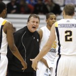 West Virginia coach Bob Huggins yells at his team during the first half against Washington in a semifinal in the East Regional of the NCAA college basketball tournament Thursday, March 25, 2010, in Syracuse, N.Y. (AP Photo/Kevin Rivoli)