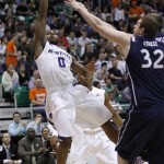 Kansas State's Jacob Pullen (0) puts up a shot as Xavier's Kenny Frease (32) defends in the first half of an NCAA West Regional semifinal college basketball game in Salt Lake City, Thursday, March 25, 2010. (AP Photo/Colin E. Braley)