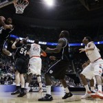 Butler's Ronald Nored, left, rebounds the ball in the second half of an NCAA West Regional semifinal college basketball game against Syracuse in Salt Lake City, Thursday, March 25, 2010. Butler won 63-59. (AP Photo/Paul Sakuma)
