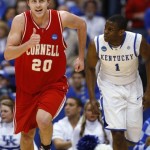 Cornell's Ryan Wittman (20) reacts after hitting a 3-point shot as Kentucky's Darius Miller (1) follows him up the court during the first half of a semifinal in the East Regional of the NCAA college basketball tournament Thursday, March 25, 2010, in Syracuse, N.Y. (AP Photo/David Duprey)