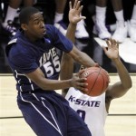 Xavier's Jordan Crawford (55) shoots as Kansas State's Jacob Pullen defends in the first half of an NCAA West Regional semifinal college basketball game in Salt Lake City, Thursday, March 25, 2010. (AP Photo/Steve C. Wilson)
