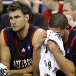 Saint Mary's Omar Samhan, right, wipes his eyes near the end of the NCAA South Regional semifinal college basketball game against Baylor in Houston, Friday, March 26, 2010. Baylor defeated Saint Mary's 72-49. At left is Saint Mary's Ben Allen. (AP Photo/David J. Phillip)