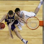 Northern Iowa's Jake Koch (20) and Michigan State's Garrick Sherman, right, fight for a rebound during the NCAA Midwest Regional college basketball game Friday, March 26, 2010, in St. Louis. (AP Photo/Paul Sancya)