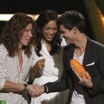 Shaun White, left, and Rosario Dawson present the award for favorite movie actor to Taylor Lautner, right, at Nickelodeon's 23rd Annual Kids' Choice Awards on Saturday, March 27, 2010, in Los Angeles. (AP Photo/Matt Sayles)