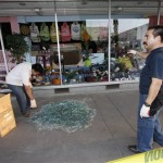 Men clean up broken glass from window store fronts in downtown Calexico, Calif. after an earthquake struck the area Sunday, April 4, 2010. The 7.2-magnitude quake struck at 3:40 p.m. about 19 miles southeast of Mexicali, a bustling commerce center on the Mexican side of the border where trucks carrying goods cross into California. (AP Photo/Denis Poroy)