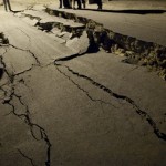 Men stand next to cracks on a street in Mexicali, Mexico, early Monday, April 5, 2010 after Sunday's powerful earthquake. According to the USGS, the earthquake's epicenter was 26 km (16 miles) south west from Guadalupe Victoria, Baja California, Mexico. (AP Photo/Guillermo Arias)