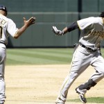 Pittsburgh Pirates' Andrew McCutchen, right, runs past coach Tony Beasley after a high-five celebrating McCutchen's home run against the Arizona Diamondbacks in the third inning of a baseball game Sunday, April 11, 2010, in Phoenix. (AP Photo/Ross D. Franklin)