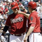 Arizona Diamondbacks' Chris Snyder, left, celebrates his two-run home run against the Pittsburgh Pirates with teammate Kelly Johnson in the second inning of a baseball game Sunday, April 11, 2010, in Phoenix. (AP Photo/Ross D. Franklin)