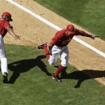 As he rounds the bases, Arizona Diamondbacks' Chris Young, right, celebrates his three-run home run against the Pittsburgh Pirates with coach Bo Porter (16) in the fourth inning of a baseball game Sunday, April 11, 2010, in Phoenix. (AP Photo/Ross D. Franklin)