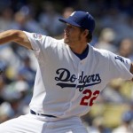 Los Angeles Dodgers starter Clayton Kershaw pitches to the Arizona Diamondbacks in the second inning in the Dodgers' home opener baseball game Tuesday, April 13, 2010 in Los Angeles. (AP Photo/Reed Saxon)