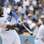 Los Angeles Dodgers' Manny Ramirez connects on a home run against Arizona Diamondbacks starting pitcher Ian Kennedy in the fourth inning in the Dodgers' home opener baseball game Tuesday, April 13, 2010. (AP Photo/Reed Saxon)