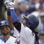 Los Angeles Dodgers Manny Ramirez points skyward as he crosses the plate on a two-RBI home run against the Arizona Diamondbacks in the fourth inning of the Dodgers' home opener baseball game Tuesday, April 13, 2010. (AP Photo/Reed Saxon)