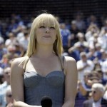 Singer LeAnn Rimes sings the National Anthem before the Los Angeles Dodgers meet the Arizona Diamondbacks in the Dodgers' home opener baseball game Tuesday, April 13, 2010 in Los Angeles. (AP Photo/Reed Saxon)