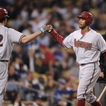 Arizona Diamondbacks' Chris Young, right, is congratulated by Dan Haren after scoring on a single by John Hester during the second inning of their Major League Baseball game against the Los Angeles Dodgers, Thursday, April 15, 2010, in Los Angeles. (AP Photo/Mark J. Terrill)