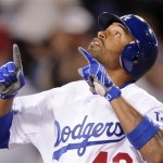 Los Angeles Dodgers' Matt Kemp points to the sky after hitting a two-run home run during the seventh inning of their Major League Baseball game against the Arizona Diamondbacks, Thursday, April 15, 2010, in Los Angeles. (AP Photo/Mark J. Terrill)