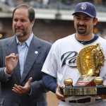 San Diego Padres CEO Jeff Moorad, left, claps as the Padres' first baseman Adrian Gonzalez receives the 2009 Rawlings Golden Glove award before a baseball game against the Arizona Diamondbacks Saturday, April 17, 2010 in San Diego. (AP Photo/Denis Poroy)