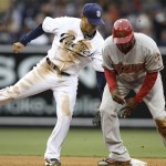 Arizona Diamondbacks Justin Upton, right, slides into second with a stolen base ahead of the tag of San Diego Padres shortstop Jerry Hairston during the fourth inning of a baseball game Saturday, April 17, 2010 in San Diego. (AP Photo/Denis Poroy)