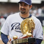 San Diego Padres first baseman Adrian Gonzalez holds up the 2009 Rawlings Golden Glove award after receiving it before a baseball game against the Arizona Diamondbacks Saturday, April 17, 2010 in San Diego. (AP Photo/Denis Poroy)