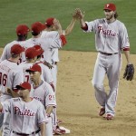 Philadelphia Phillies' Jayson Werth, right, is congratulated by teammates after defeating the Arizona Diamondbacks in the ninth inning of a baseball game Saturday, April 24, 2010, in Phoenix. Werth hit two home runs in the game, including the game-winning blast off Diamondbacks pitcher Juan Gutierrez in the ninth inning. The Phillies won 3-2. (AP Photo/Paul Connors)