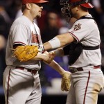 Arizona Diamondbacks relief pitcher Chad Qualls, left, is congratulated by catcher Chris Snyder after retiring Colorado Rockies pinch-hitter Jason Giambi for the final out in the ninth inning of the Diamondbacks' 5-3 victory in a baseball game on Monday, April 26, 2010, in Denver. Qualls earned his fifth save of the season for his effort. (AP Photo/David Zalubowski)