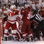 Phoenix Coyotes defenseman Adrian Aucoin (33) and Detroit Red Wings center Johan Franzen (93) scuffle during the first period of Game 7 of an NHL first-round playoff hockey series Tuesday, April 27, 2010, in Glendale, Ariz. (AP Photo/Ross D. Franklin)