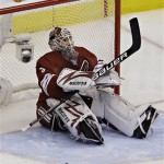 Phoenix Coyotes goalie Ilya Bryzgalov sits after Detroit Red Wings center Pavel Datsyuk scored during the second period of Game 7 of an NHL first-round playoff hockey series Tuesday, April 27, 2010, in Glendale, Ariz. (AP Photo/Ross D. Franklin)