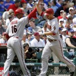 Arizona Diamondbacks' Adam LaRoche, right, celebrates with third base coach Bo Porter after hitting a three-run home run against the Chicago Cubs during the fourth inning of a baseball game Thursday, April 29, 2010, in Chicago.(AP Photo/Nam Y. Huh)
 