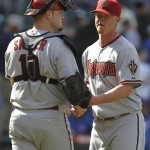 Arizona Diamondbacks closer Daniel Stange, right, celebrates with catcher Chris Snyder after they defeated the Chicago Cubs 13-5 in a baseball game Thursday, April 29, 2010, in Chicago.(AP Photo/Nam Y. Huh)