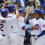 Chicago Cubs' Kosuke Fukudome, right, of Japan, celebrates with Ryan Theriot, left, Tyler Colvin, second from left, and Geovany Soto after hitting a grand slam against the Arizona Diamondbacks during the eighth inning of a baseball game Thursday, April 29, 2010, in Chicago. (AP Photo/Nam Y. Huh)
