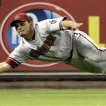 Arizona Diamondbacks left fielder Gerardo Parra dives to catch a fly ball hit by Houston Astros' Geoff Blum for the final out of the baseball game in the ninth inning Tuesday, May 4, 2010 in Houston. The Diamondbacks beat the Astros 1-0. (AP Photo/David J. Phillip)