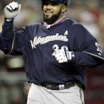 Milwaukee Brewers' Prince Fielder smiles as he crosses home plate after hitting a solo home run against the Arizona Diamondbacks during the second inning of a baseball game Sunday, May 9, 2010, in Phoenix. (AP Photo/Matt York)