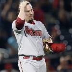 Arizona Diamondbacks relief pitcher Chad Qualls wipes his face after loading the bases in the inning of a baseball game against the Atlanta Braves Friday, May 14, 2010 in Atlanta. (AP Photo/John Bazemore)