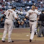 San Francisco Giants' Aaron Rowand, right, is congratulated by Bengie Molina after Rowand scored on a single by Pablo Sandoval against the Arizona Diamondbacks in the first inning of a baseball game Wednesday, May 19, 2010, in Phoenix. (AP Photo/Paul Connors)