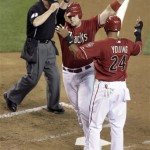 Arizona Diamondbacks' Chris Snyder, center, is congratulated at home plate by Chris Young, right, in front of umpire Jerry Meals after Snyder hit a two-run home run off San Francisco Giants pitcher Denny Bautista in the sixth inning of a baseball game Wednesday, May 19, 2010, in Phoenix. (AP Photo/Paul Connors)