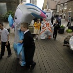 The Olympic mascot Wenlock, right, and the Paralympic mascot Mandeville walk with school children as they are unveiled to the media as the mascots for London 2012, at a school in London, Wednesday, May 19, 2010.(AP Photo/Matt Dunham)
