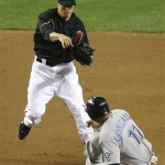 Arizona Diamondbacks second baseman Kelly Johnson throws to first after forcing out Toronto Blue Jays' Alex Gonzalez during the fifith inning of an interleague baseball game Saturday, May 22, 2010, in Phoenix. John Buck was safe at first. (AP Photo/Ralph Freso)
