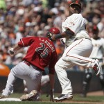 Arizona Diamondbacks' Adam LaRoche, left, is tagged out by San Francisco Giants third baseman Pablo Sandoval during the seventh inning of a baseball game Sunday, May 30, 2010, in San Francisco. LaRoche was attempting to advance on a single by Gerardo Parra. (AP Photo/Ben Margot)