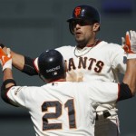 San Francisco Giants' Andres Torres, top, celebrates with Freddy Sanchez (21) after Torres drove in the winning run with a single during the 10th inning of a baseball game against the Arizona Diamondbacks on Sunday, May 30, 2010, in San Francisco. The Giants won 6-5. (AP Photo/Ben Margot)